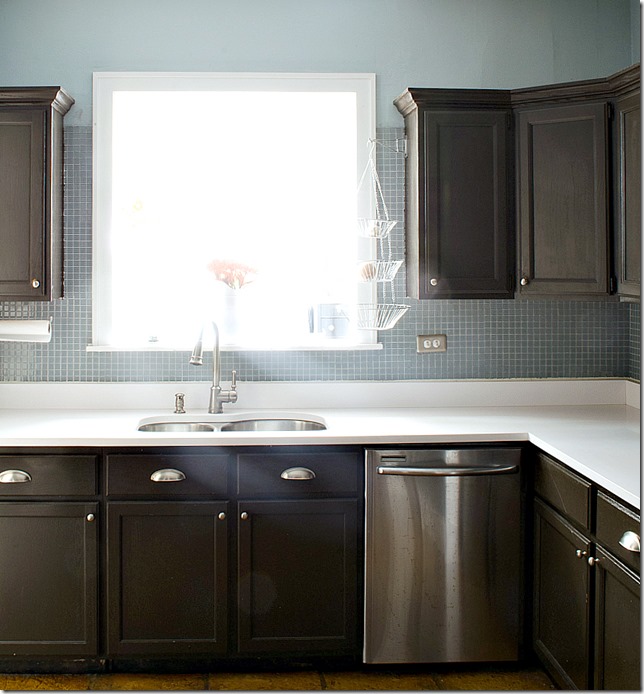 kitchen dark counters white counter and blue backspash