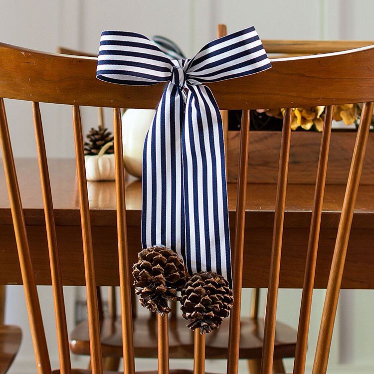 Decorating Backs of Dining Room Chairs with Ribbon and Pine Cones