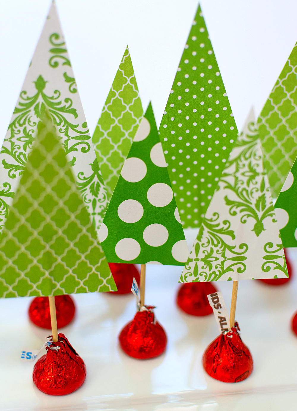 Christmas Crafts with Kids and Kisses. Easy kids crafts for Christmas. Easy paper tree centerpiece. Tutorial on how to make a Christmas tree centerpiece with Scrapbook Paper and Hershey Kisses. Holiday-Centerpiece-Idea-Hershey-Kiss-Mas-Tree-Forest-Wine-Corks (8 of 14)