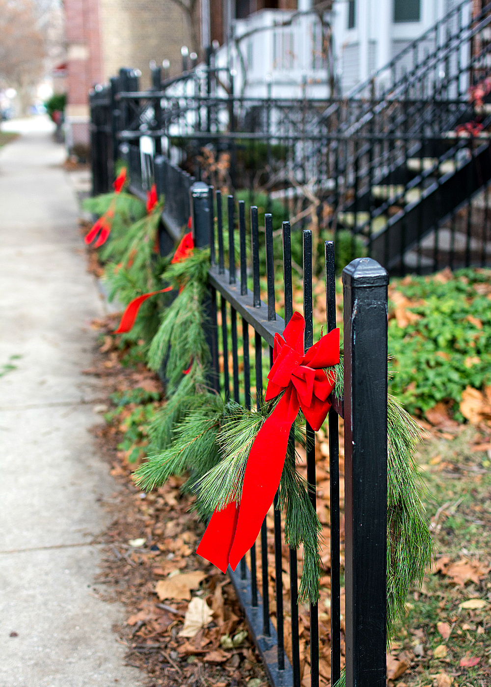 Christmas Decor Outdoors with Garland and Red Bows