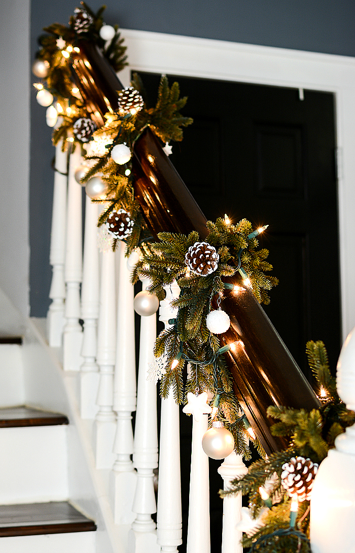 Garland on Stairs Decorated with Ornaments and Pine Cones