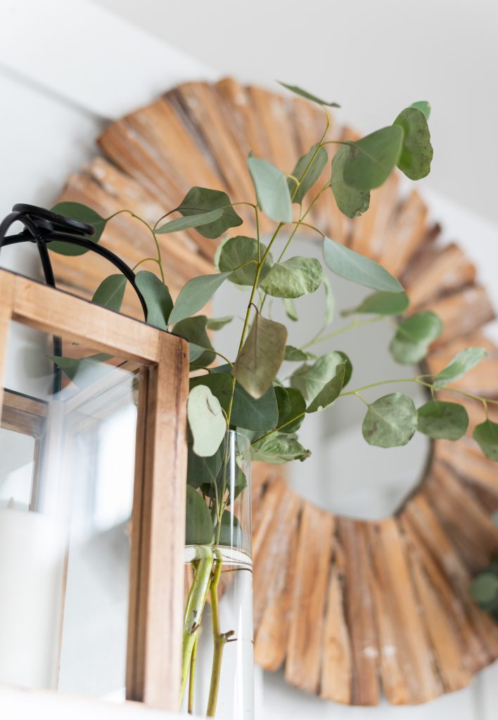 Simple mantel with lanterns and eucalyptus