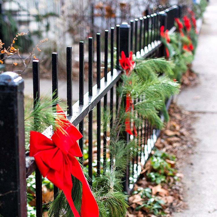 iron fence with garland and bows - It All Started With Paint