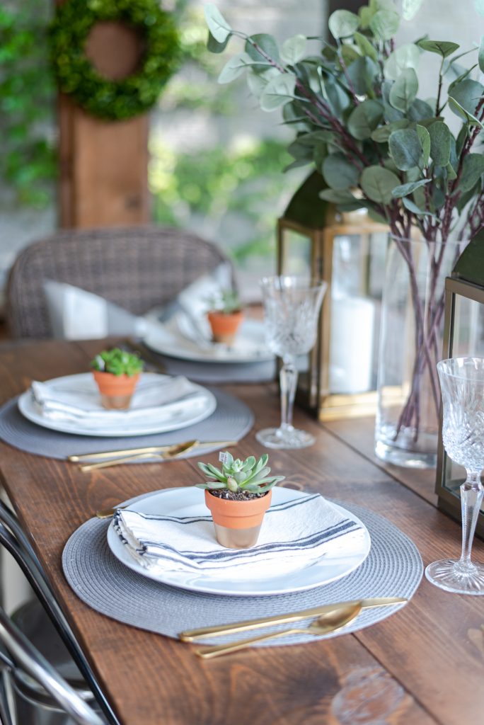 Gold Lantern, Succulent Place Card Holder, Grosgrain gray white striped napkin, gold flatware, faux eucalyptus centerpiece - Summer Table Setting in Gray, White, Gold - Summer Table Setting Ideas