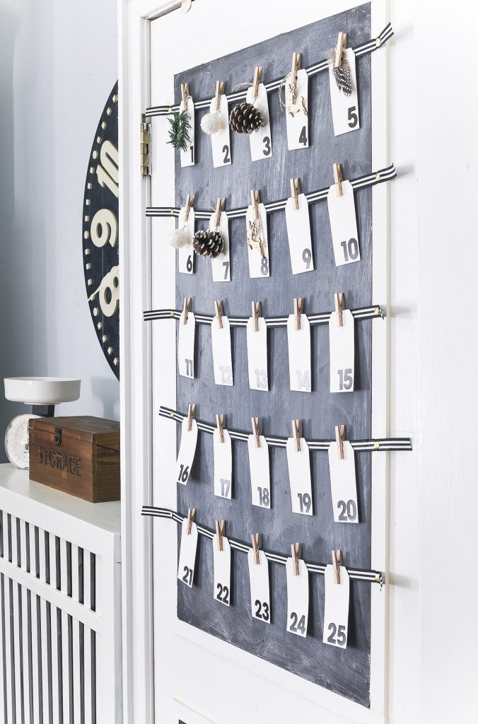 Countdown to Christmas Calendar DIY. Christmas Kitchen with Mini Wreaths on Kitchen Cabinet Doors. How to Hange Mini Wreaths on Cabinet Doors. Mini Wreaths with Black and White Ribbon Decor Ideas. Black and White Christmas Decor Ideas.