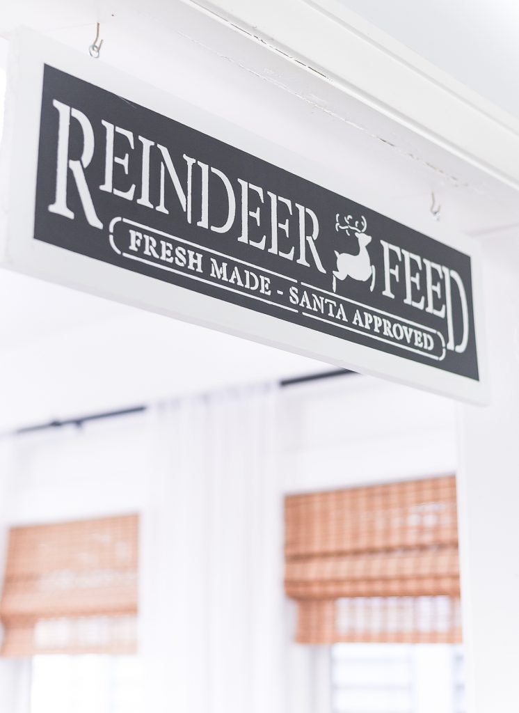 Christmas Reindeer Feed Sign DIY. Countdown to Christmas Calendar DIY. Christmas Kitchen with Mini Wreaths on Kitchen Cabinet Doors. How to Hange Mini Wreaths on Cabinet Doors. Mini Wreaths with Black and White Ribbon Decor Ideas. Black and White Christmas Decor Ideas.