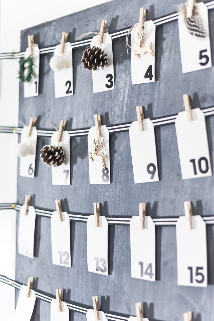 Countdown to Christmas Calendar DIY. Christmas Kitchen with Mini Wreaths on Kitchen Cabinet Doors. How to Hange Mini Wreaths on Cabinet Doors. Mini Wreaths with Black and White Ribbon Decor Ideas. Black and White Christmas Decor Ideas.