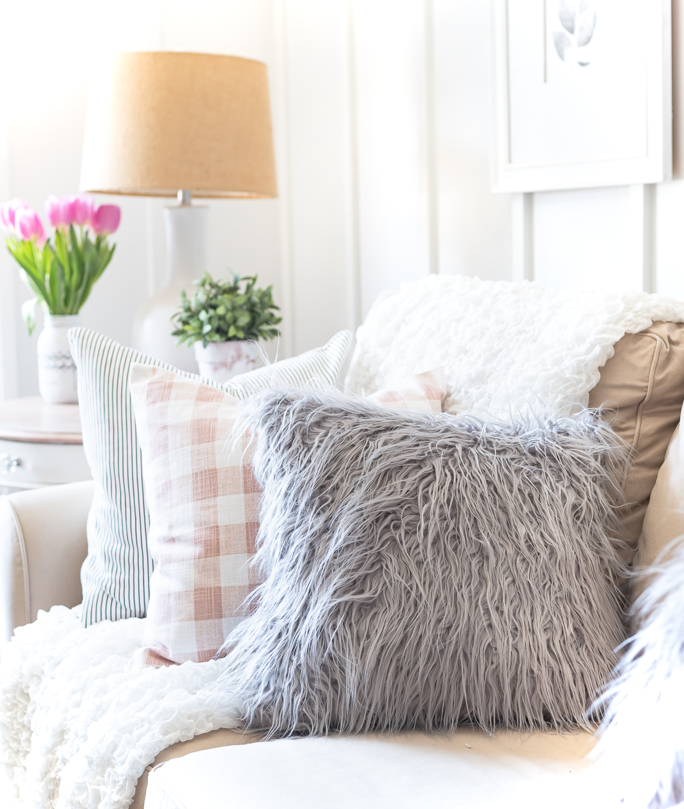 Spring decorating ideas in pink and gray -furry gray pillow