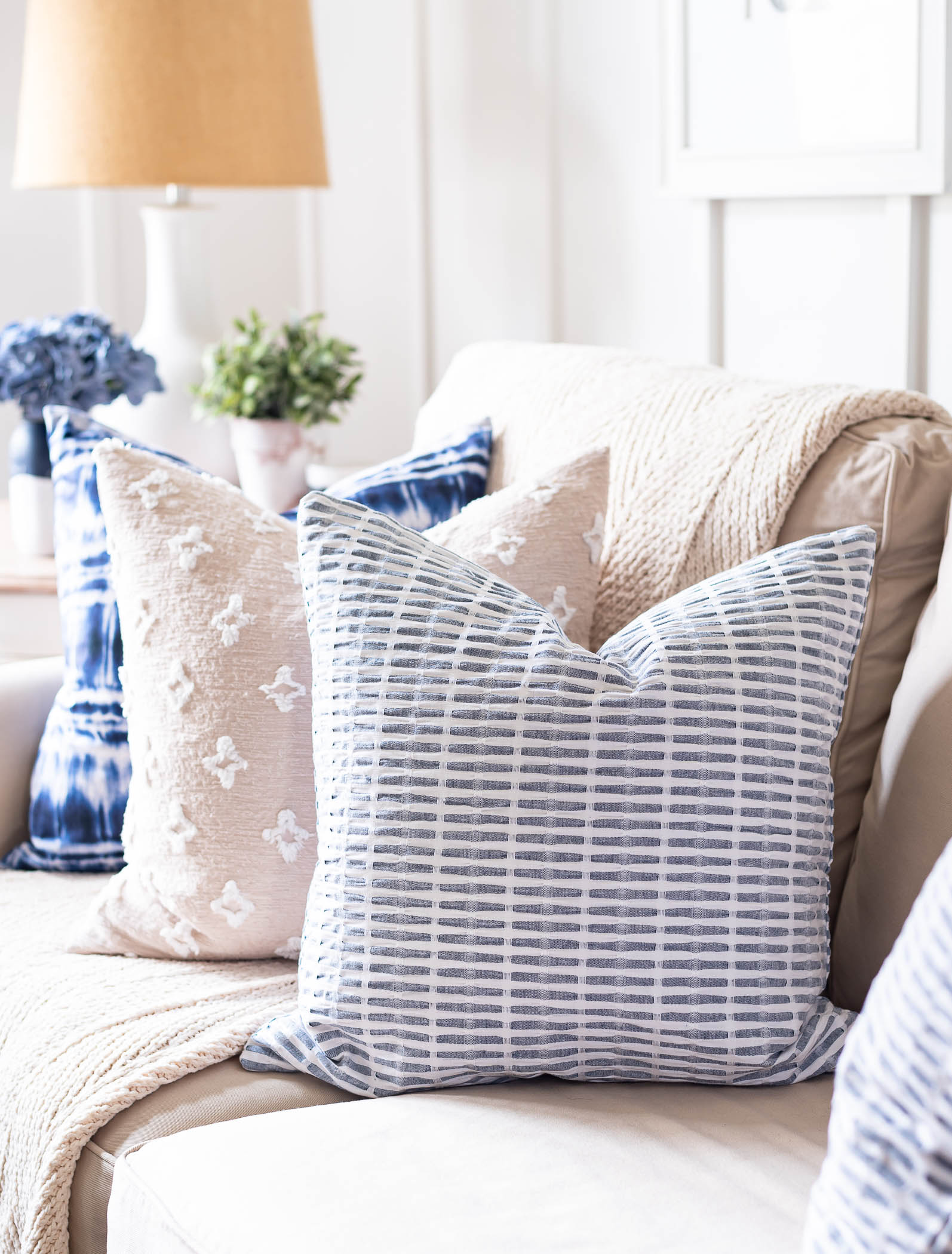 Blue and White Pillows on Couch for Spring