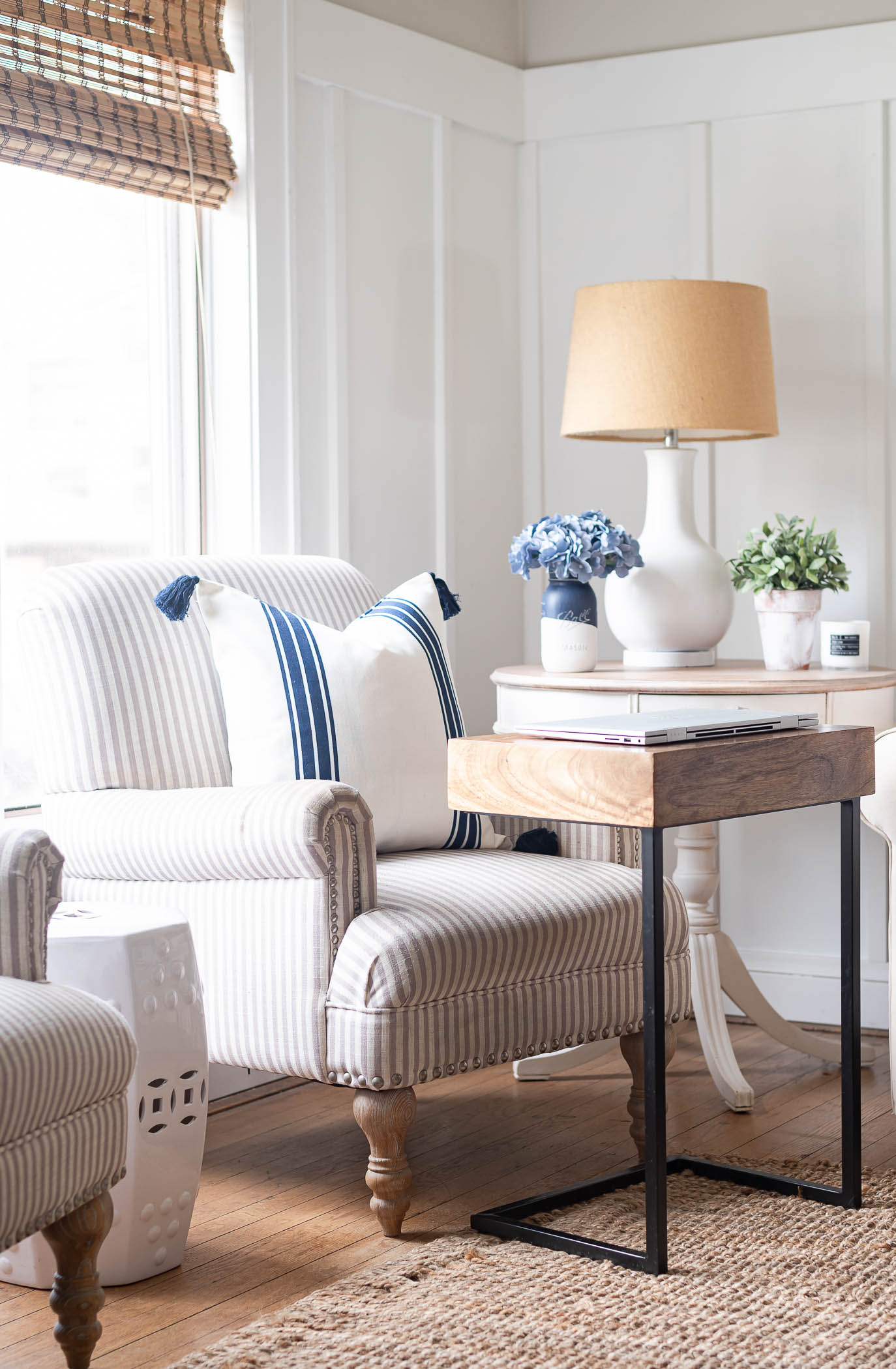 Neutral cream and tan Wayfair chair, board and batten living room, gray living room, jute rug in living room, gray walls in living room