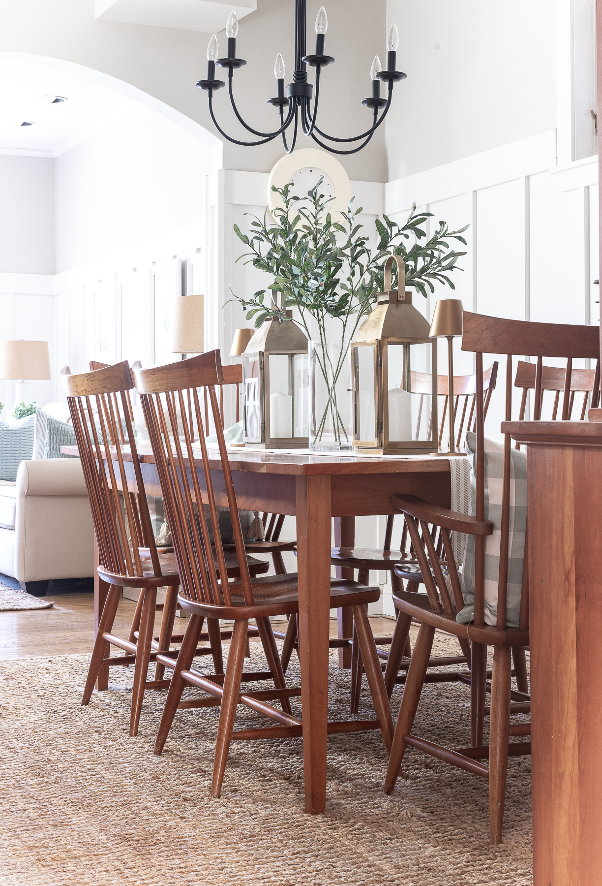 Board and batten dining room - shaker dining room in natural cherry - neutral dining room for spring - tan and white table runner - large gold lanterns - cordless lamps in gold