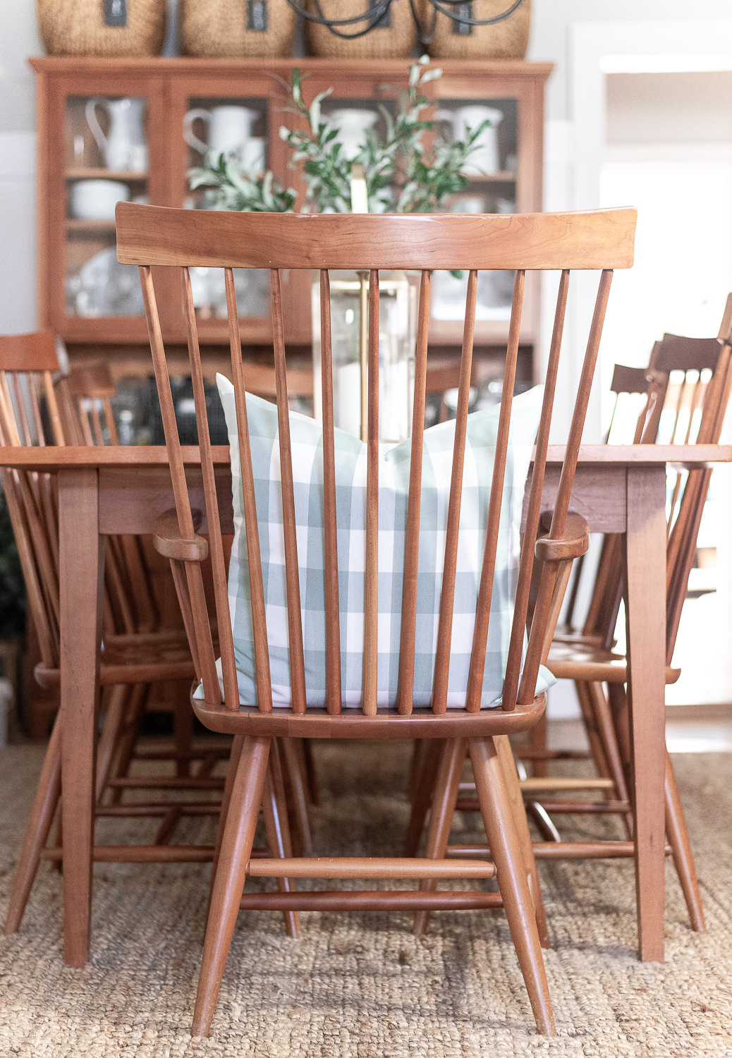 Board and batten dining room - shaker dining room in natural cherry - neutral dining room for spring - tan and white table runner - large gold lanterns - cordless lamps in gold