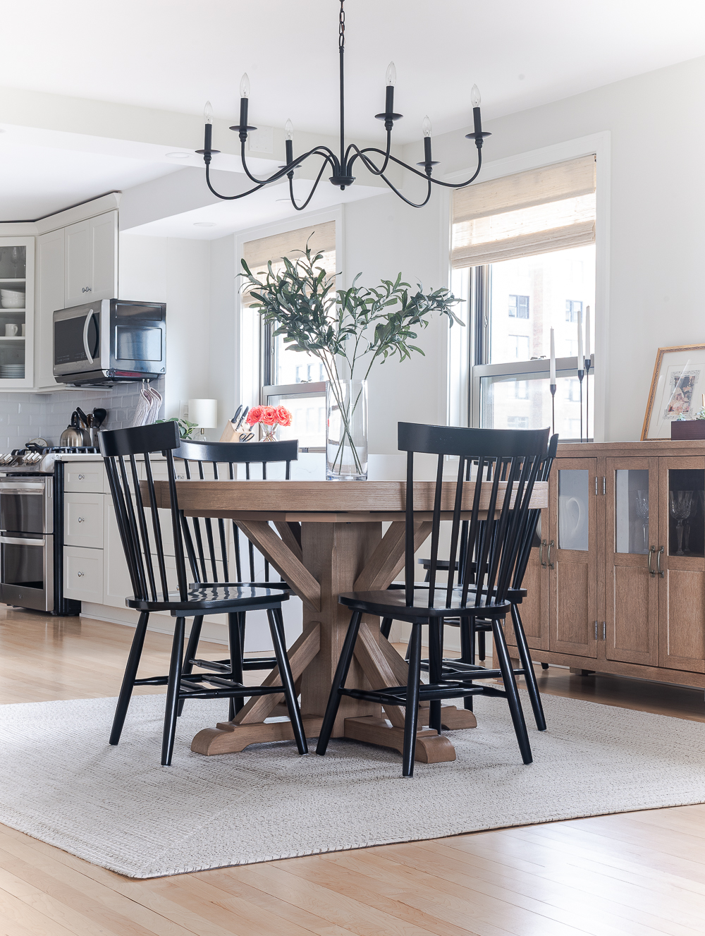 Neutral, White, Wood, Black Dining Room - Chicago Condo Dining Room Reveal - Black Iron Chandelier, Round Table, Black Windsor Chairs