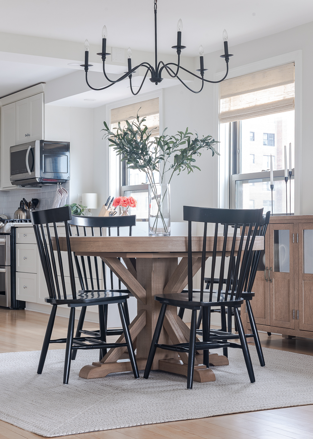 Neutral, White, Wood, Black Dining Room - Chicago Condo Dining Room Reveal - Black Iron Chandelier, Round Table, Black Windsor Chairs