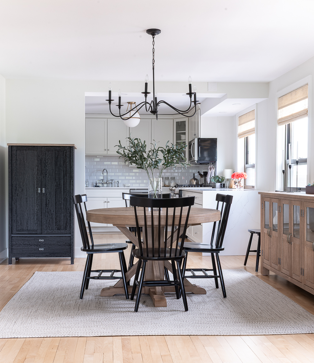 Neutral, White, Wood, Black Dining Room - Chicago Condo Dining Room Reveal - Black Iron Chandelier, Round Table, Black Windsor Chairs