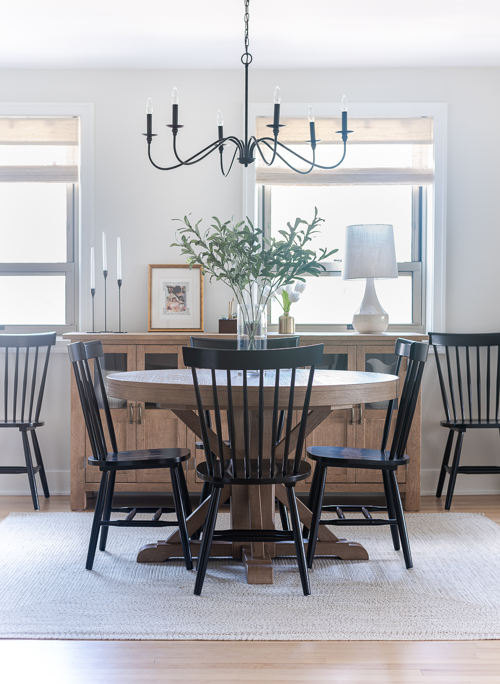 Neutral, White, Wood, Black Dining Room - Chicago Condo Dining Room Reveal - Black Iron Chandelier, Round Table, Black Windsor Chairs