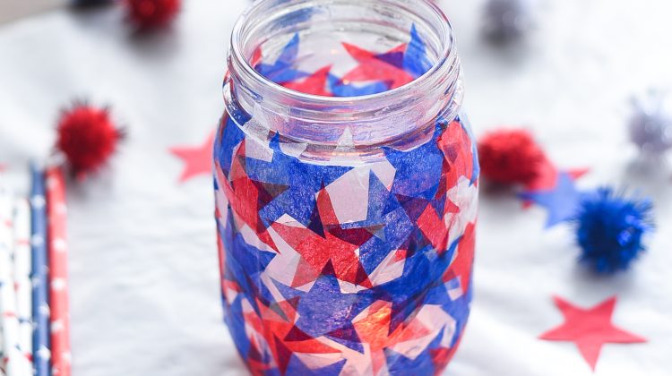 Tissue paper stained glass mason jar craft. Red white blue tissue paper craft. Mod Podge jar in red, white blue. Star shaped tissue paper decoupage mason.