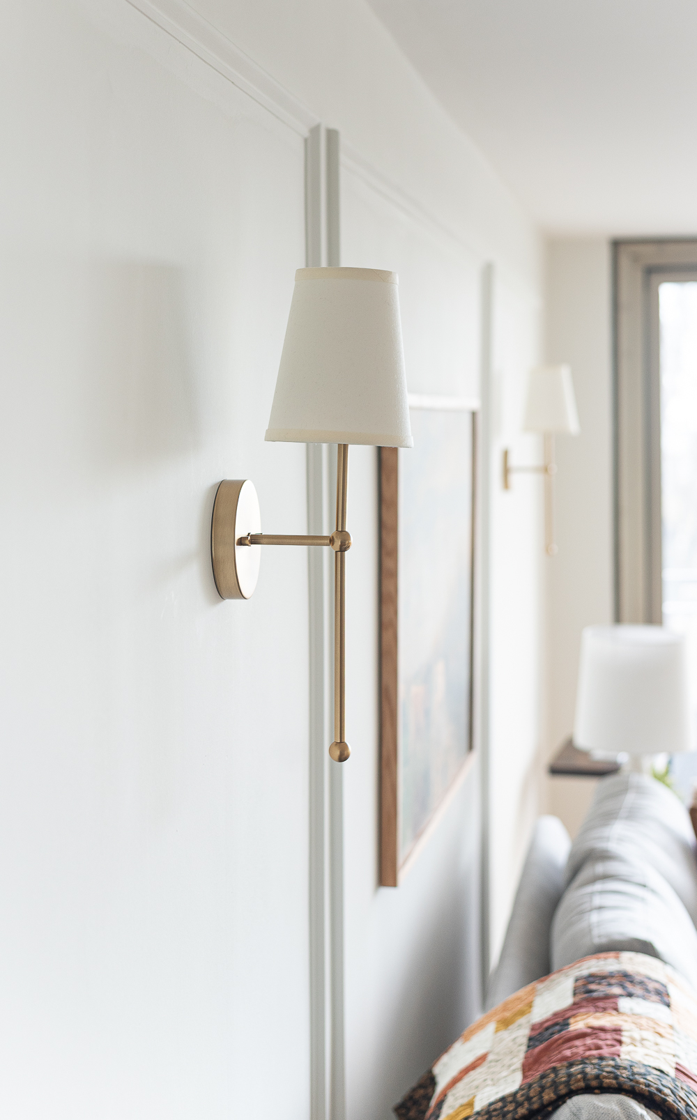 Fall Living Room in Rust, Brown, Mustard, Black, Gray, Neutral. Mustard PIllow. Faux Leather Ottomon from Amazon. Crate & Barrel Barrett Sectional Sofa. Pottery Barn TV Console. Wayfair Side Tables in Light Wood. Vintage Cow Print on Canvas.