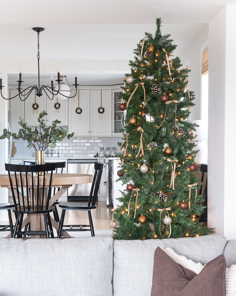 Christmas in the Dining Room. Neutral Christmas with Khaki Velvet Bows, Browns, Burgundies, Gold. Rustic Christmas Tree with Painted Pine Cones, Neutral Light Brown Velvet Ribbons, Gold, Burgundy, Brown Balls.