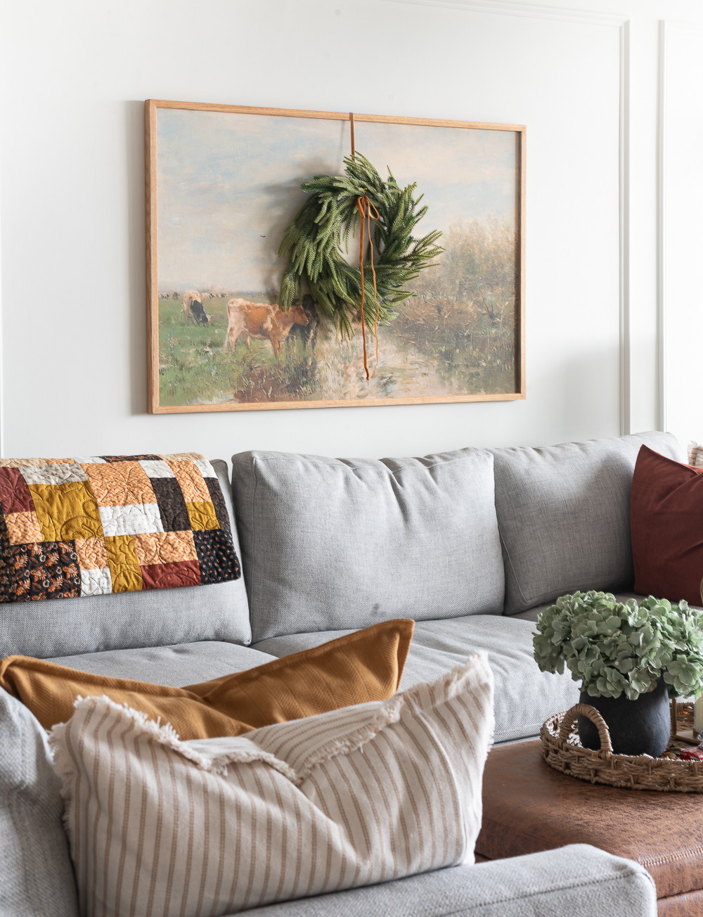 Neutral Christmas Decor in Khaki Velvet, Brown, Burgundy, White & Gold. Christmas in Chicago Condo. Christmas in Living Room Decorating Ideas. Hanging Wreaths on Pictures with thin Velvet Ribbon and Bows. Christmas in Brown, Burgundy, Tan, Khaki, Gold, White.