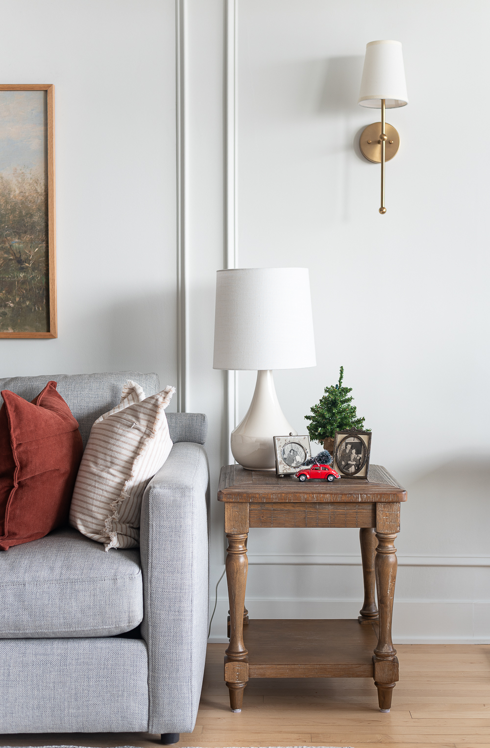 Neutral Christmas Decor in Khaki Velvet, Brown, Burgundy, White & Gold. Christmas in Chicago Condo. Christmas in Living Room Decorating Ideas. Hanging Wreaths on Pictures with thin Velvet Ribbon and Bows. Christmas in Brown, Burgundy, Tan, Khaki, Gold, White.