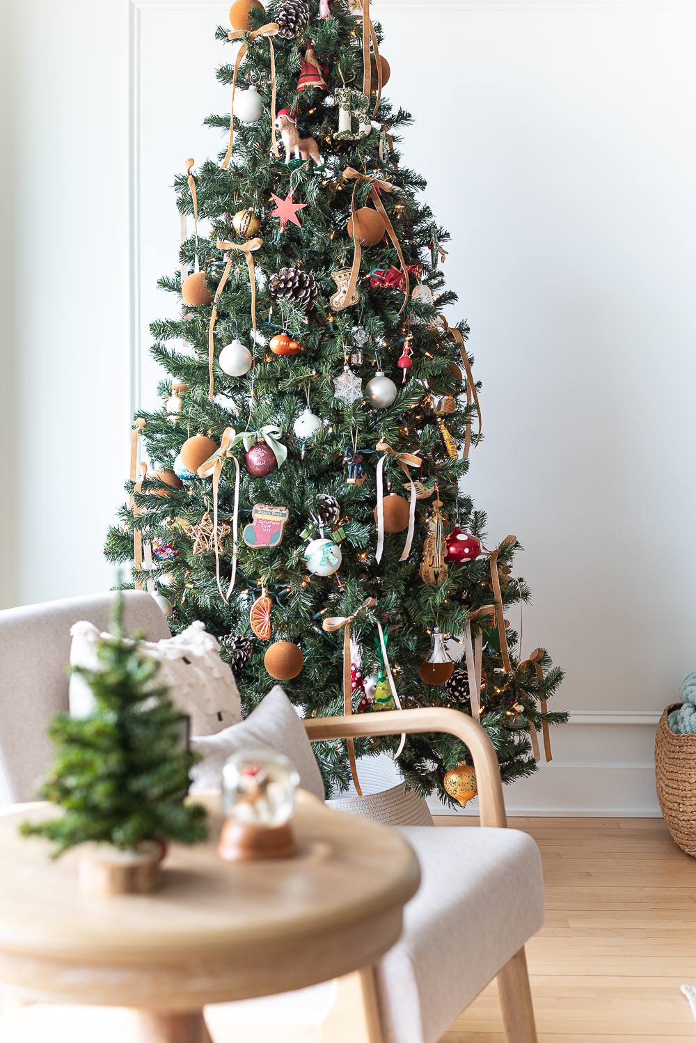 Neutral Christmas Decor in Khaki Velvet, Brown, Burgundy, White & Gold. Christmas in Chicago Condo. Christmas in Living Room Decorating Ideas. Hanging Wreaths on Pictures with thin Velvet Ribbon and Bows. Christmas in Brown, Burgundy, Tan, Khaki, Gold, White.