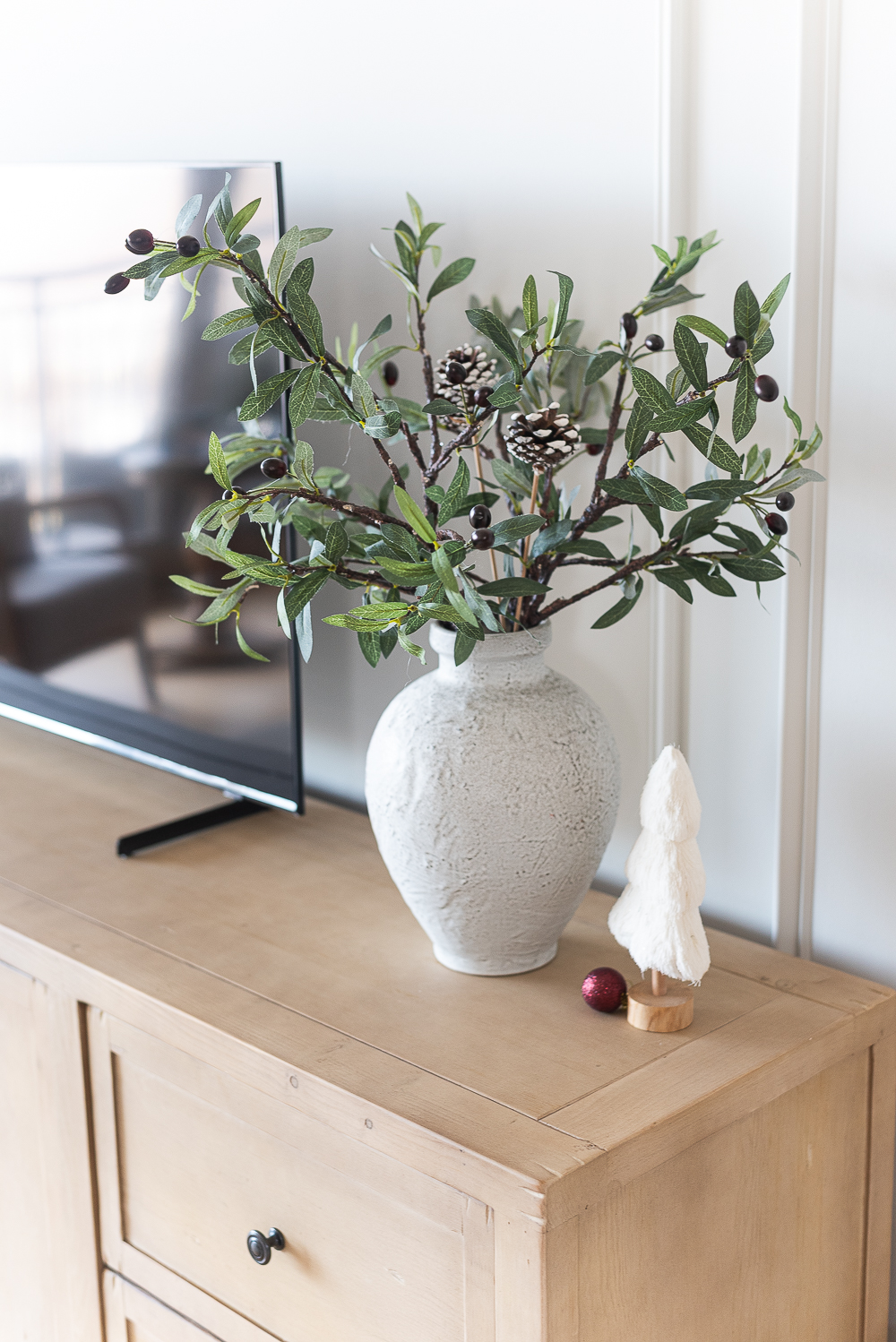 Neutral Christmas Decor in Khaki Velvet, Brown, Burgundy, White & Gold. Christmas in Chicago Condo. Christmas in Living Room Decorating Ideas. Hanging Wreaths on Pictures with thin Velvet Ribbon and Bows. Christmas in Brown, Burgundy, Tan, Khaki, Gold, White.