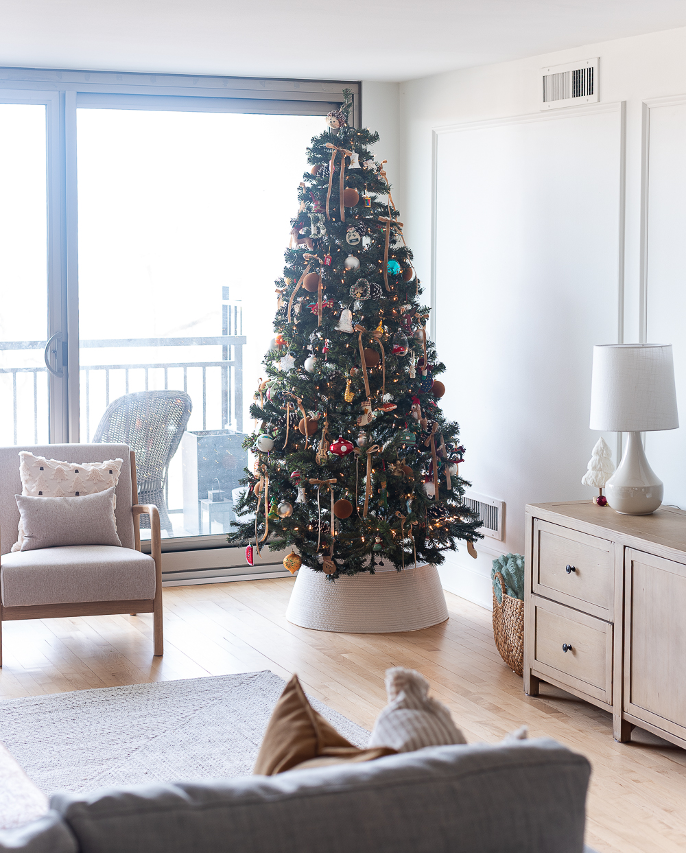 Neutral Christmas Decor in Khaki Velvet, Brown, Burgundy, White & Gold. Christmas in Chicago Condo. Christmas in Living Room Decorating Ideas. Hanging Wreaths on Pictures with thin Velvet Ribbon and Bows. Christmas in Brown, Burgundy, Tan, Khaki, Gold, White.