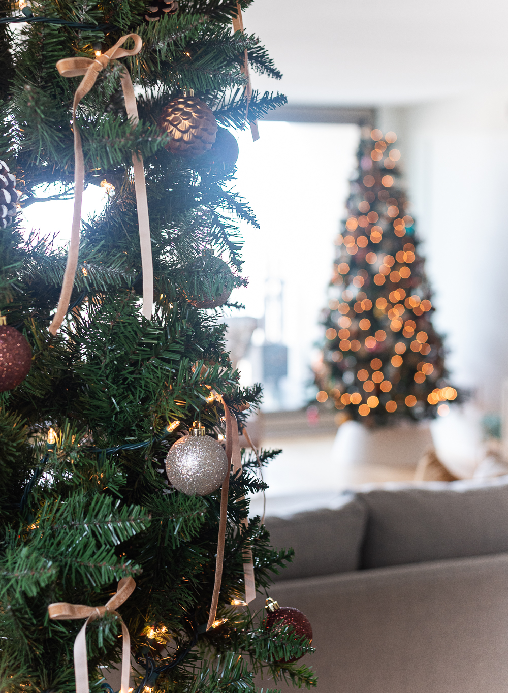 Neutral Christmas Decor in Khaki Velvet, Brown, Burgundy, White & Gold. Christmas in Chicago Condo. Christmas in Living Room Decorating Ideas. Hanging Wreaths on Pictures with thin Velvet Ribbon and Bows. Christmas in Brown, Burgundy, Tan, Khaki, Gold, White.