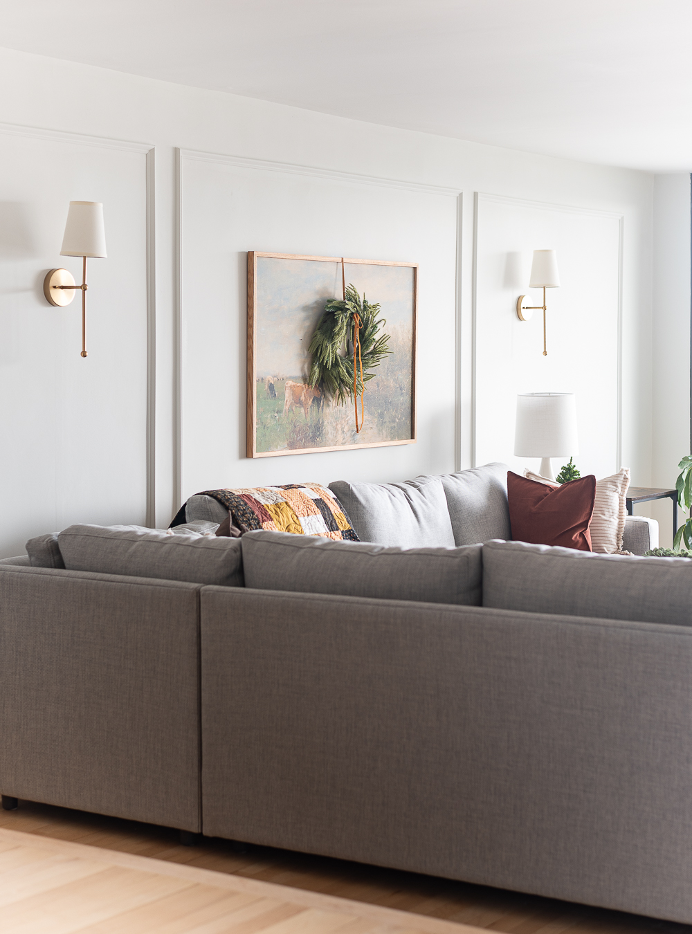 Neutral Christmas Decor in Khaki Velvet, Brown, Burgundy, White & Gold. Christmas in Chicago Condo. Christmas in Living Room Decorating Ideas. Hanging Wreaths on Pictures with thin Velvet Ribbon and Bows. Christmas in Brown, Burgundy, Tan, Khaki, Gold, White.