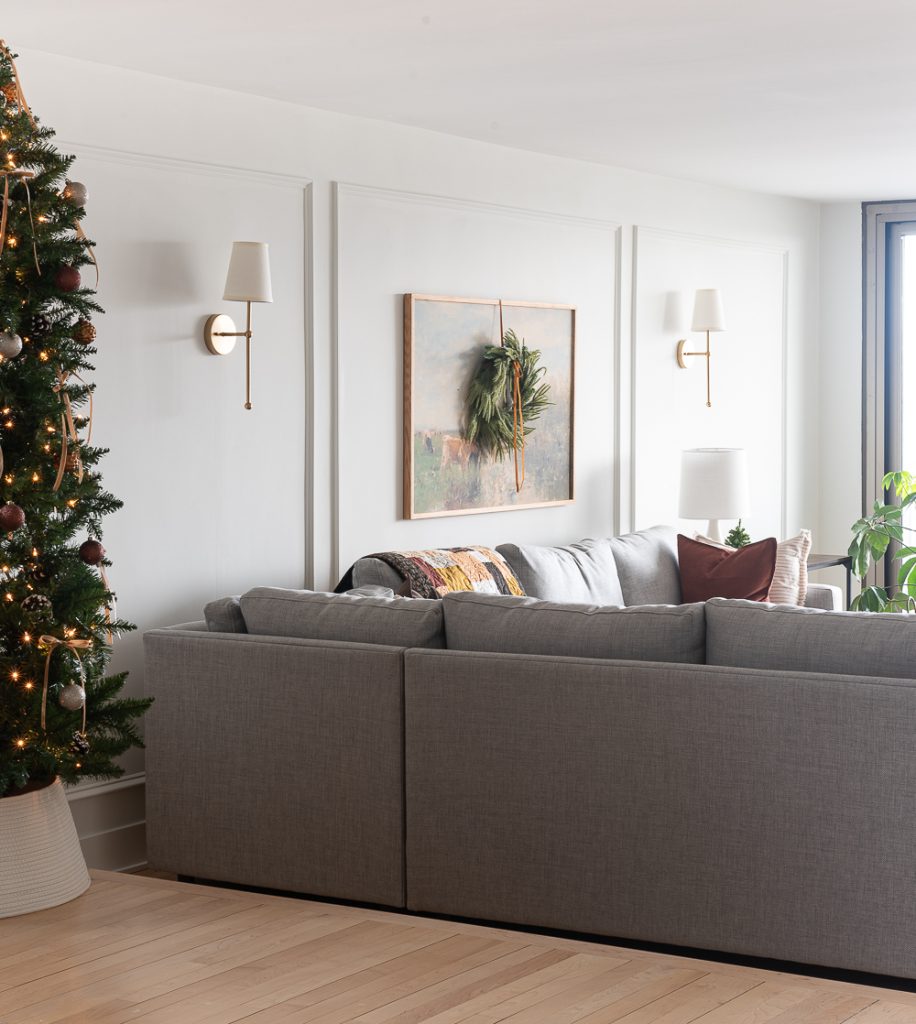 Neutral Christmas Decor in Khaki Velvet, Brown, Burgundy, White & Gold. Christmas in Chicago Condo. Christmas in Living Room Decorating Ideas. Hanging Wreaths on Pictures with thin Velvet Ribbon and Bows. Christmas in Brown, Burgundy, Tan, Khaki, Gold, White.