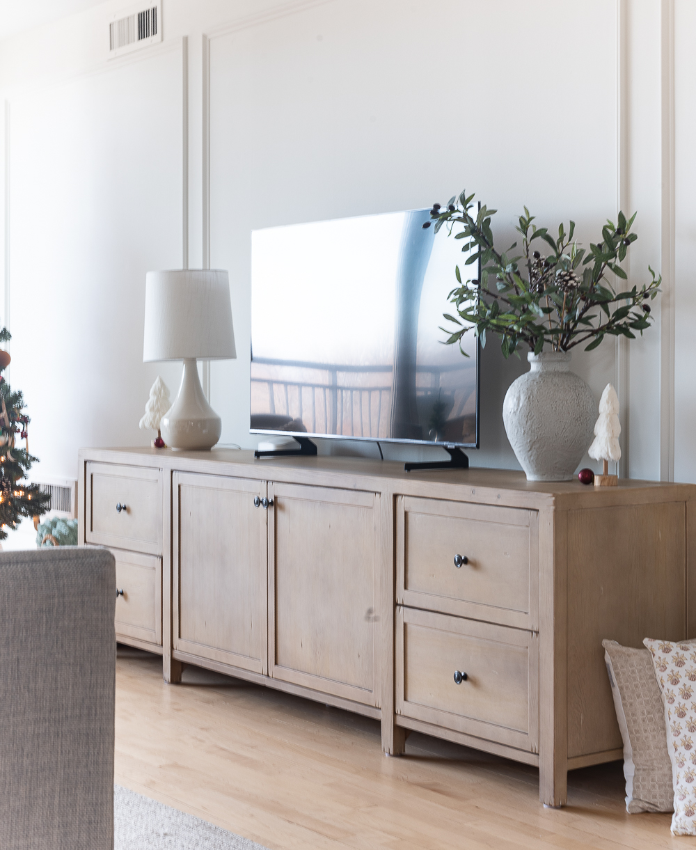 Neutral Christmas Decor in Khaki Velvet, Brown, Burgundy, White & Gold. Christmas in Chicago Condo. Christmas in Living Room Decorating Ideas. Hanging Wreaths on Pictures with thin Velvet Ribbon and Bows. Christmas in Brown, Burgundy, Tan, Khaki, Gold, White.